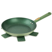 Green 10 in nonstick fry pan with felt protectors under the pan