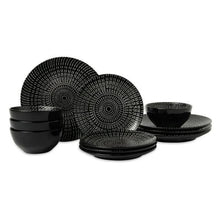 Black stoneware dinner plates and bowls with concentric ridged pattern