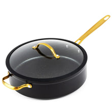 Black non-stick sauté pan with glass lid and gold handles