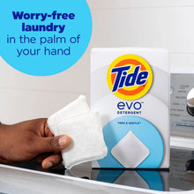 White detergent fiber tile and Tide evo container beside a top-load washer