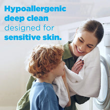 Hypoallergenic deep-clean laundry detergent for sensitive skin, mother holding child near washer.