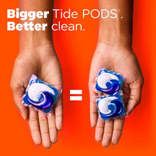 Two blue-and-white detergent pods held in hands.