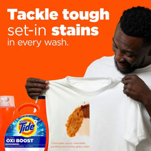 Tide Ultra Oxi Boost detergent bottle beside a white T-shirt with visible stain mark.