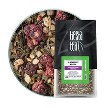 Loose leaf herbal tea bag labeled Blackberry Bellini, beside a bowl of loose tea.