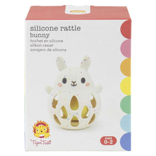 Retail box for cream silicone bunny baby rattle, ages 0–2.
