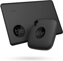 Two black Tile Bluetooth trackers, mate and slim shapes with keyring holes