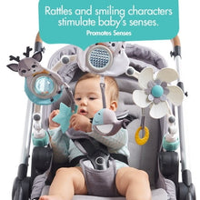 Baby in stroller with overhead play arch featuring hedgehog, flower, and fish rattles