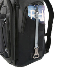26-can backpack cooler close-up of front mesh pocket and zipper with hanging tag
