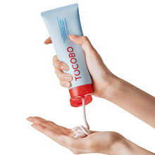Tocobo cleansing foam tube dispensing white foam onto hands