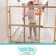 Toddleroo toddler safety gate with natural wood frame and white wire mesh