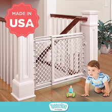 Soft white stair safety gate with hinged mesh door, secured between posts