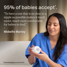 Healthcare provider holding a baby feeding bottle for infant feeding
