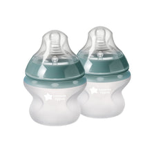 Tommee Tippee silicone baby bottle set, teal caps, white bottle bodies, slow flow nipples