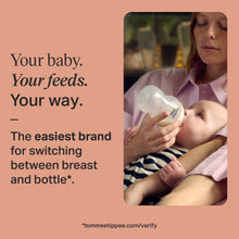 Parent feeding baby with a Tommee Tippee Natural Start bottle