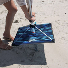 Blue striped beach umbrella base with central pole and ANCHORX logo