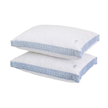 Quilted white pillow set, light blue striped edge and small pineapple logo