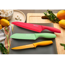 Colorful kitchen knives on a tray, including red, green, and orange blades