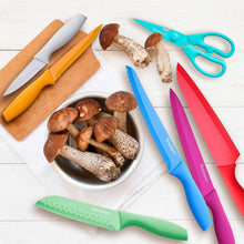 Colorful kitchen knife set with matching blade guards and blue kitchen shears
