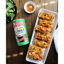 Tony Chachere's Original Creole Seasoning can next to a tray of seasoned food