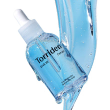 Light-blue hyaluronic acid serum bottle with white dropper, close-up
