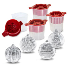 Four ice mold pieces with clear textured ice cavities and red silicone lids