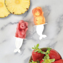 Pop ice molds with pink, orange, and white mermaid and animal shapes