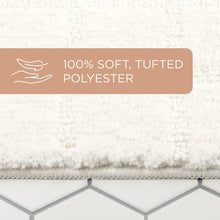 White tufted bath mat with braided edge and close-up of plush surface