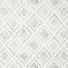Ivory kitchen mat close-up with repeating geometric diamond and square pattern
