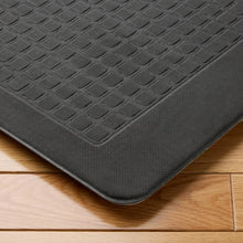Kitchen mat with dark gray raised diamond texture and thick cushioned edge