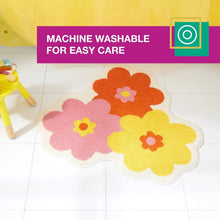 Bath mat with orange, pink, and yellow flower design on white border