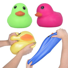 Green jumbo squishy duck toy with cartoon eyes and orange beak, rounded shape.