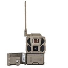 Gray cellular trail camera with external antenna and open side access panel
