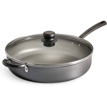 Steel gray covered jumbo cooker with glass lid and black knob, black handles
