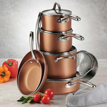 Nonstick cookware set with copper pots, matching lids, and stainless-steel handles