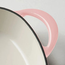 Heart-shaped dutch oven interior with cream enamel and pink rim