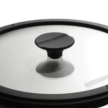 Cast iron lid with round knob and black rim, glass top
