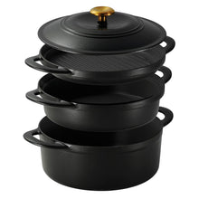 Black enamel cast iron cookware set stacked with lids and gold knobs
