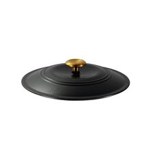 Black enamel lid with raised rim and gold knob