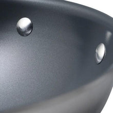 Dark nonstick fry pan interior with stainless rivets