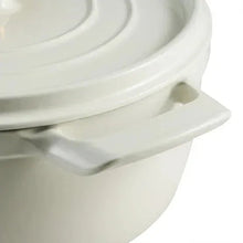 White enameled Dutch oven side with loop handle and embossed details