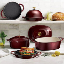 Burgundy enameled cast iron Dutch oven set with lids and cookware pieces