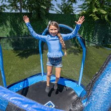 Kids jumping on black trampoline mat inside blue safety enclosure