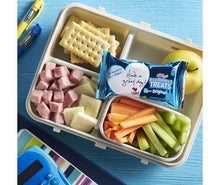 Snack tray with Rice Krispies Treats Original bar packets and fruit sticks