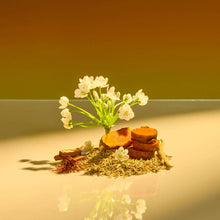 Moisturizing shave oil with flowers, herbs, and wood pieces