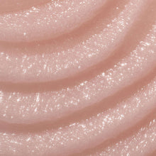 Close-up of pink shea sugar scrub with sparkling exfoliating granules