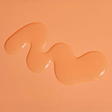 Tangerine moisturizing shave oil thick gel swirl on a smooth surface