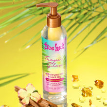 Moisturizing shave oil bottle with orange pump beside flowers and golden oil droplets
