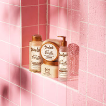 Set of Tree Hut Vanilla shaving products on a shower ledge with pumps