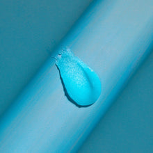 Blue sugar scrub swirl with granules on skin