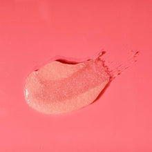 Spoonful of pink granulated body scrub paste